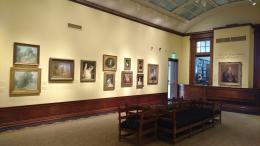 Art gallery with fine art paintings hanging on the wall